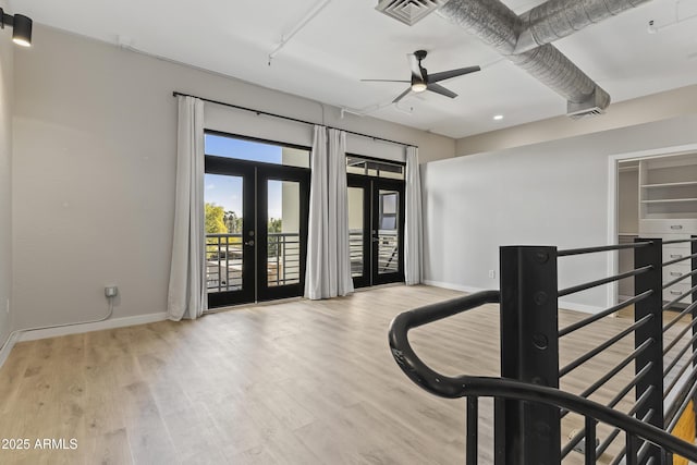 interior space with light hardwood / wood-style floors and french doors