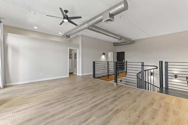 interior space featuring ceiling fan and light hardwood / wood-style floors