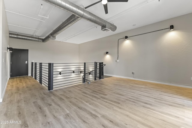 spare room with ceiling fan and light hardwood / wood-style flooring