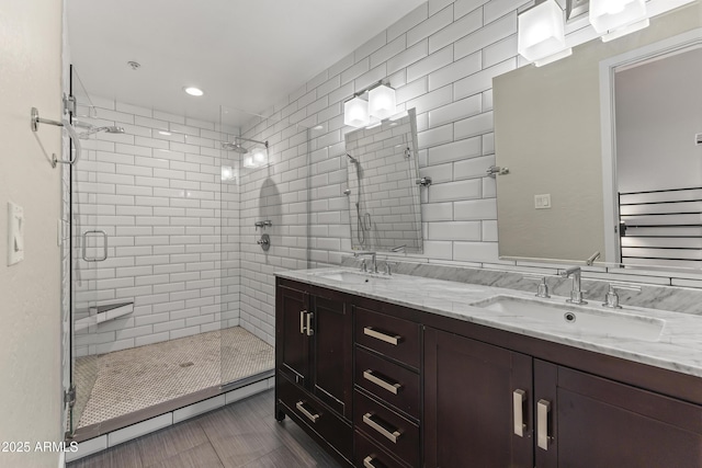 bathroom featuring vanity, tile patterned flooring, and a shower with door