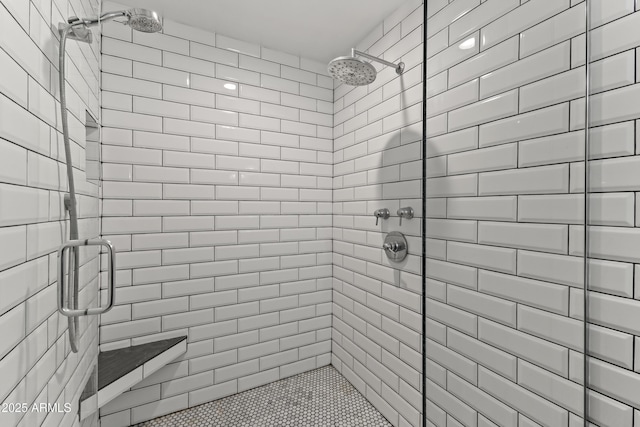 bathroom with a shower with shower door