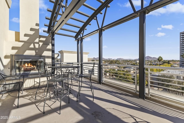 view of patio featuring an outdoor fireplace