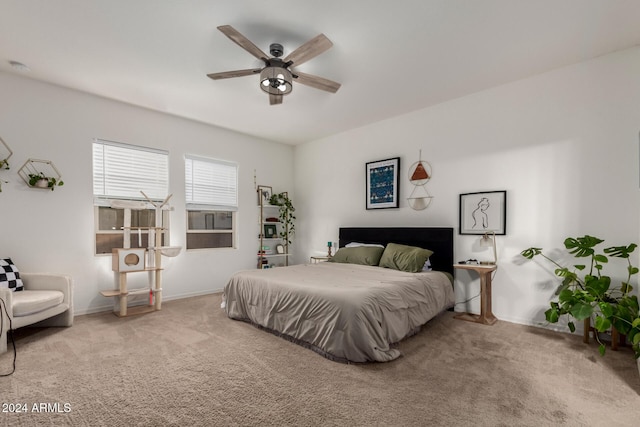 bedroom with light carpet and ceiling fan