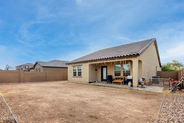 rear view of house with a patio