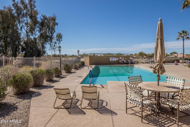 view of pool featuring a patio