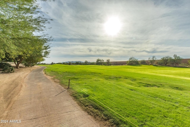 exterior space featuring a rural view and a lawn