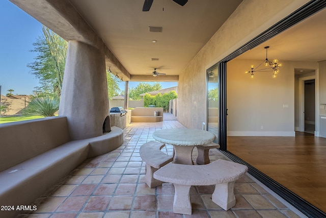 view of patio / terrace featuring an outdoor kitchen and ceiling fan