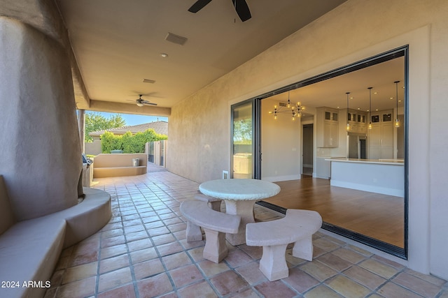 view of patio / terrace featuring ceiling fan