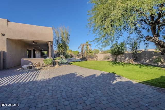 view of patio / terrace featuring ceiling fan