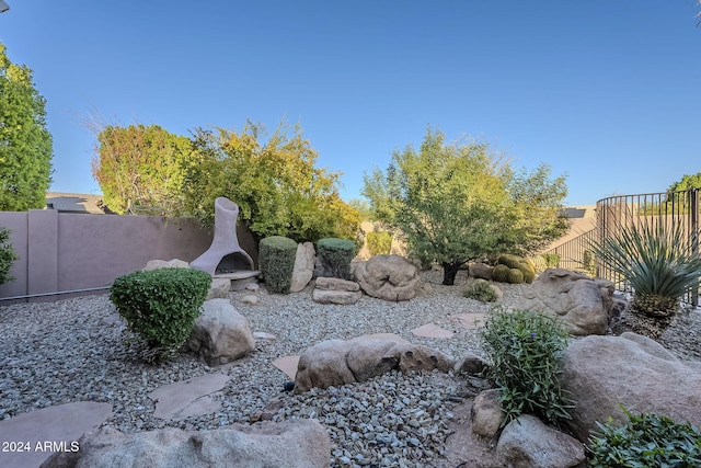 view of yard featuring a fireplace