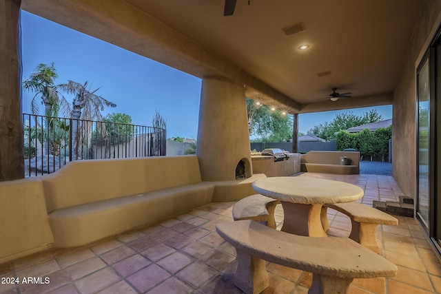 view of patio / terrace featuring area for grilling and ceiling fan