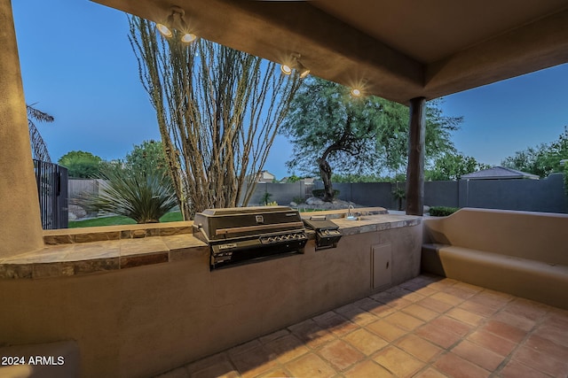 view of patio with grilling area and exterior kitchen