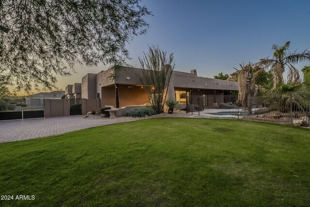 24005 N 45th Dr, Glendale, AZ 85310 - back of property with a gate and stucco siding