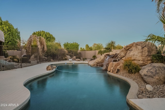 view of pool with a water slide