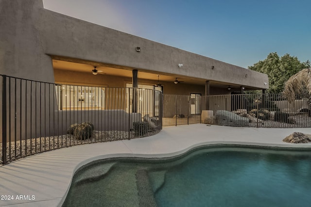 view of pool with ceiling fan and a patio area