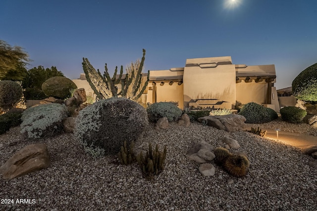 view of property exterior at dusk