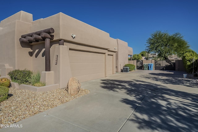 view of property exterior with a garage