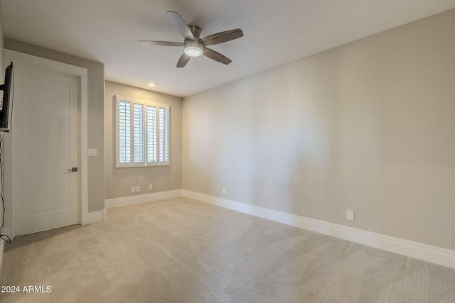 carpeted empty room with ceiling fan