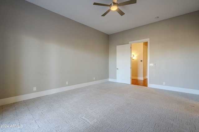 carpeted empty room with ceiling fan