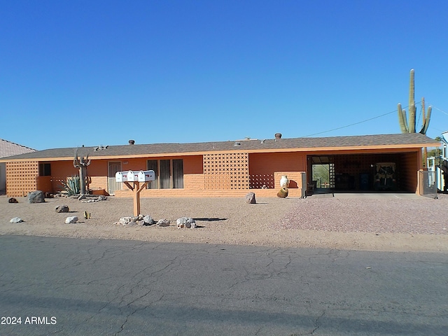 view of front of home featuring a carport