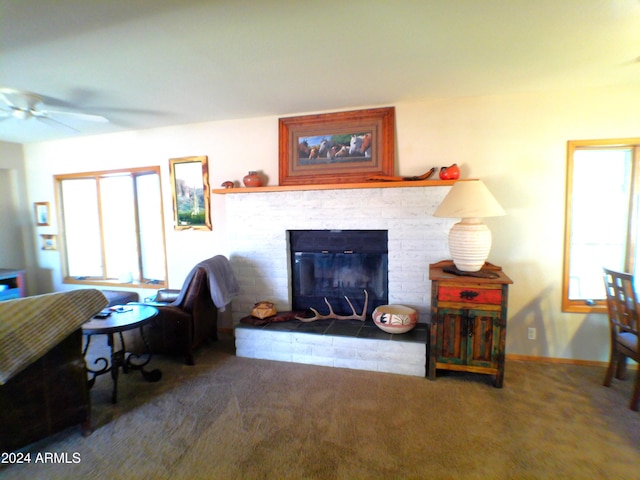 living room featuring ceiling fan and carpet