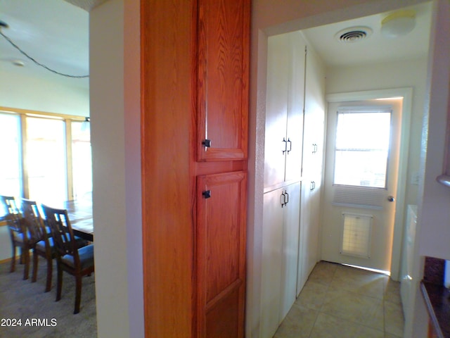 interior space with light tile patterned floors