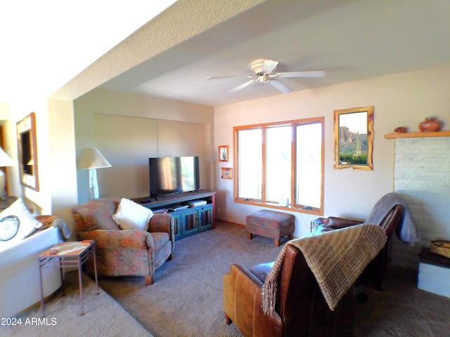 living room featuring carpet and ceiling fan