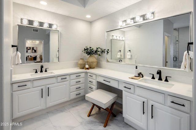 bathroom featuring vanity and walk in shower