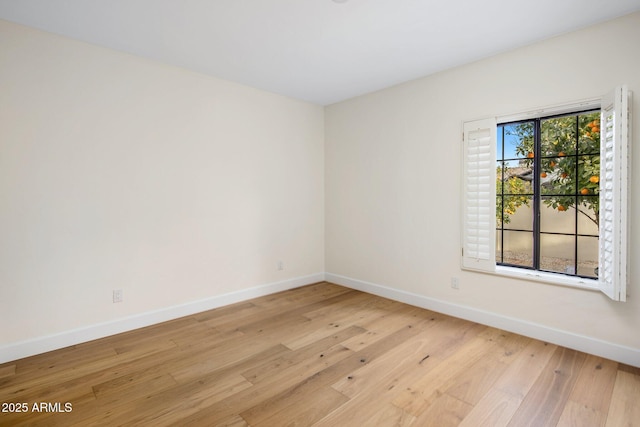 spare room featuring light hardwood / wood-style flooring