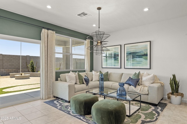1342 W Hess Ave, Coolidge, AZ 85128 - living room with tile patterned floors, recessed lighting, and a chandelier