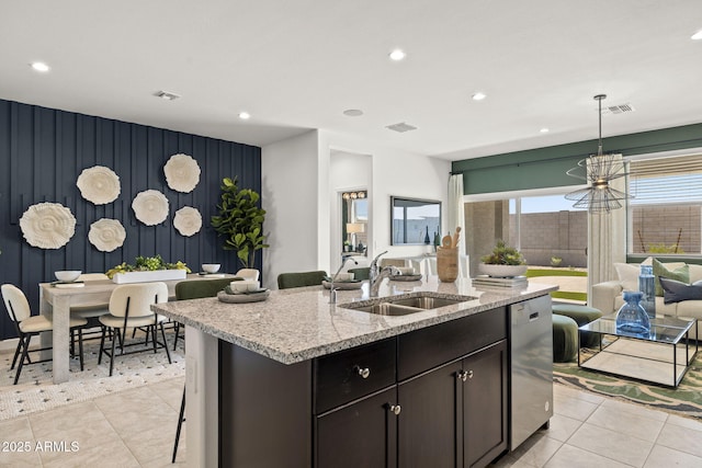 1342 W Hess Ave, Coolidge, AZ 85128 - kitchen with a sink, dishwasher, an accent wall, recessed lighting, and open floor plan
