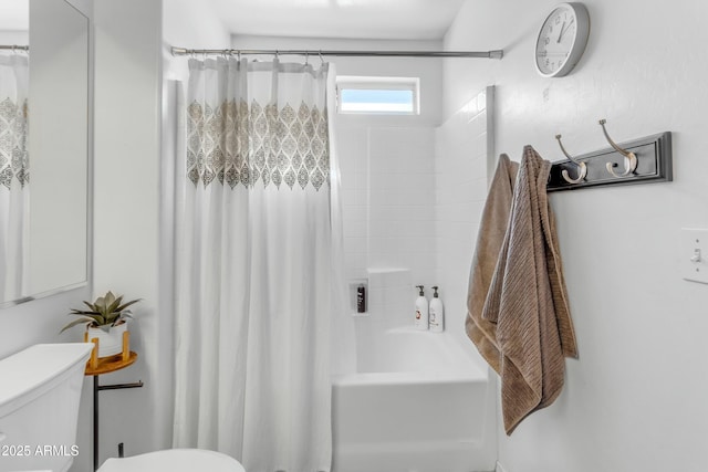 bathroom with shower / bathtub combination with curtain and toilet