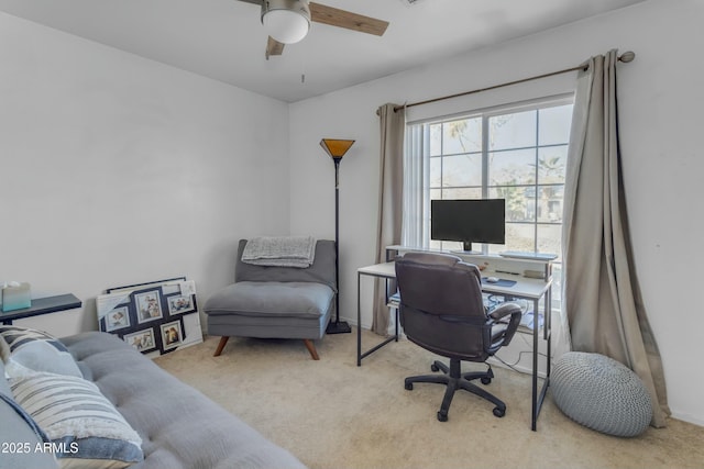 office with light carpet and ceiling fan