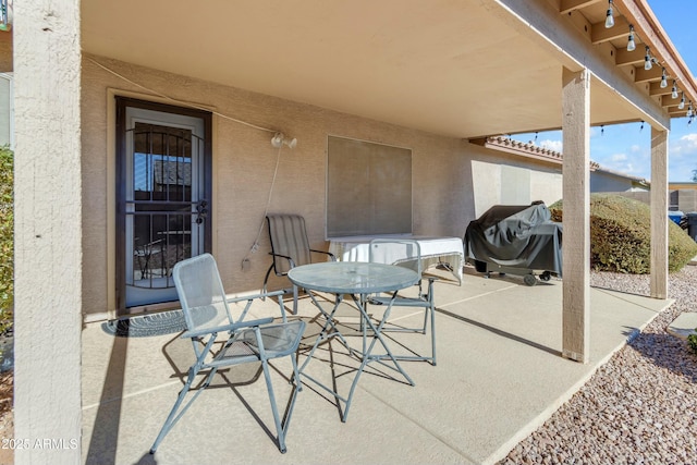 view of patio with a grill