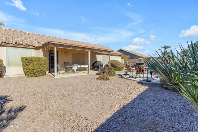 rear view of house with a patio