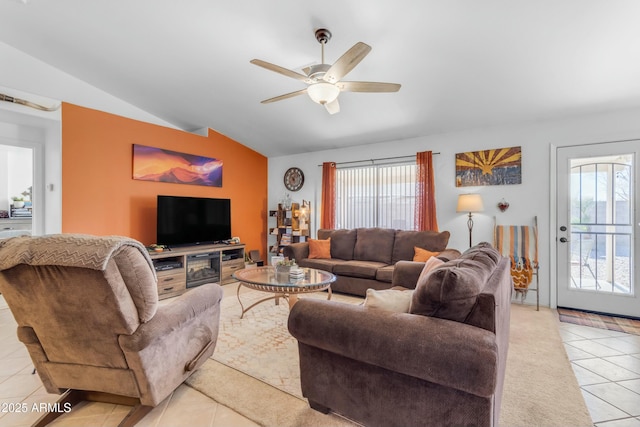 tiled living room with lofted ceiling and ceiling fan