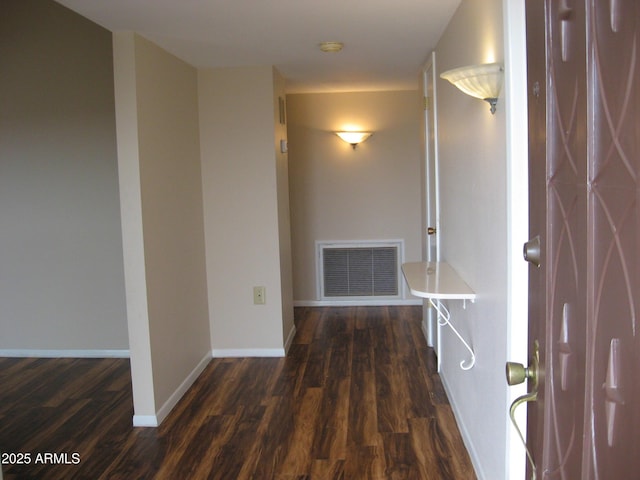 corridor featuring dark wood-type flooring