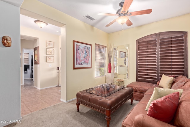 5314 W Bowker St, Laveen, AZ 85339 - living room featuring ceiling fan, light tile patterned floors, and light colored carpet