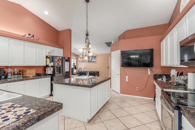 kitchen featuring white cabinetry, appliances with stainless steel finishes, pendant lighting, and light tile patterned floors