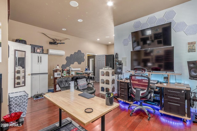 office space with an AC wall unit, recessed lighting, and wood finished floors