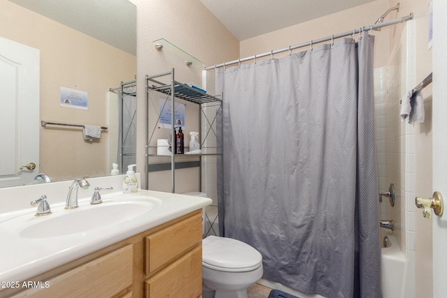 bathroom featuring shower / bath combo with shower curtain, toilet, and vanity