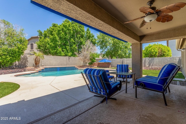 view of patio featuring a fenced backyard, a ceiling fan, and a fenced in pool