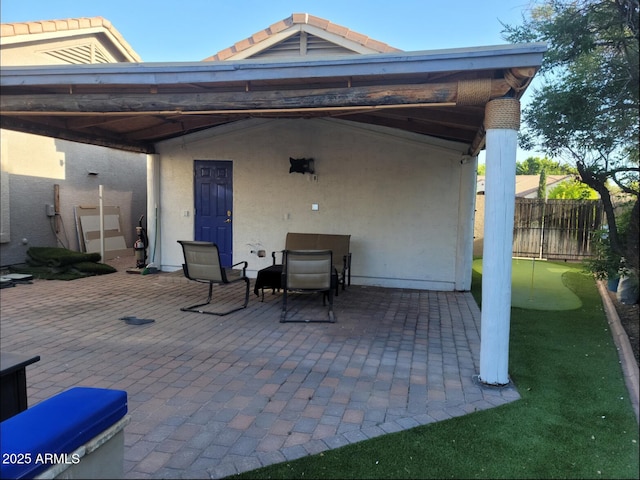 view of patio / terrace featuring fence