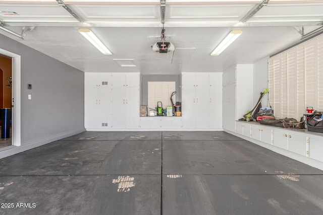 garage featuring a garage door opener