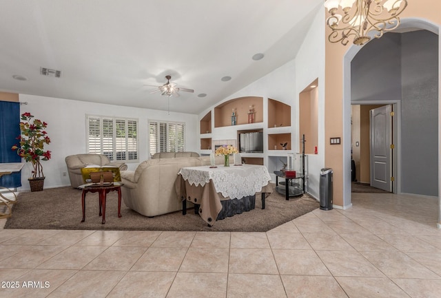 bedroom featuring arched walkways, ceiling fan with notable chandelier, light tile patterned floors, vaulted ceiling, and visible vents