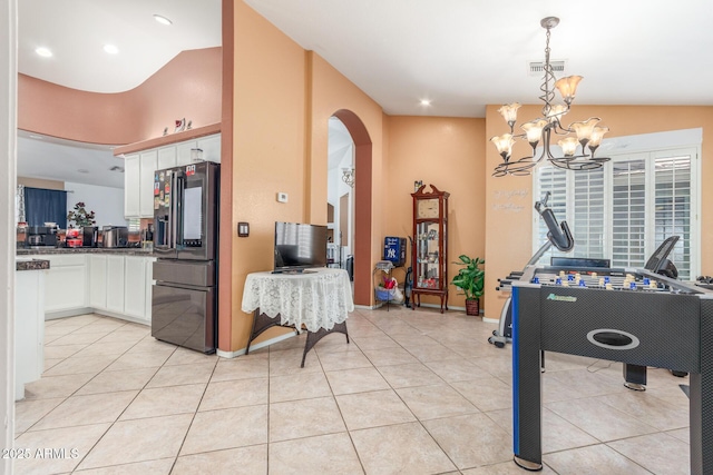 playroom with visible vents, arched walkways, light tile patterned floors, an inviting chandelier, and recessed lighting