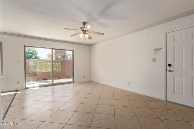 empty room with light tile patterned floors, baseboards, ceiling fan, and ornamental molding