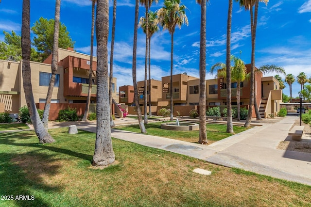 view of community featuring a residential view and a lawn