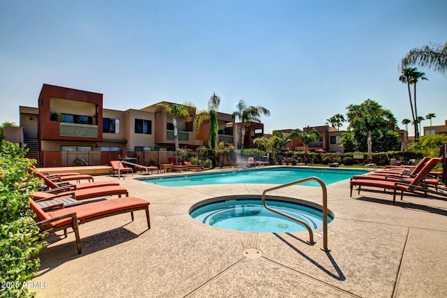 pool featuring a patio, fence, a residential view, and a community hot tub