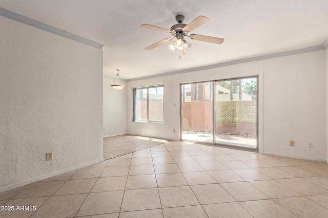 unfurnished room with a textured wall, a ceiling fan, baseboards, light tile patterned floors, and ornamental molding
